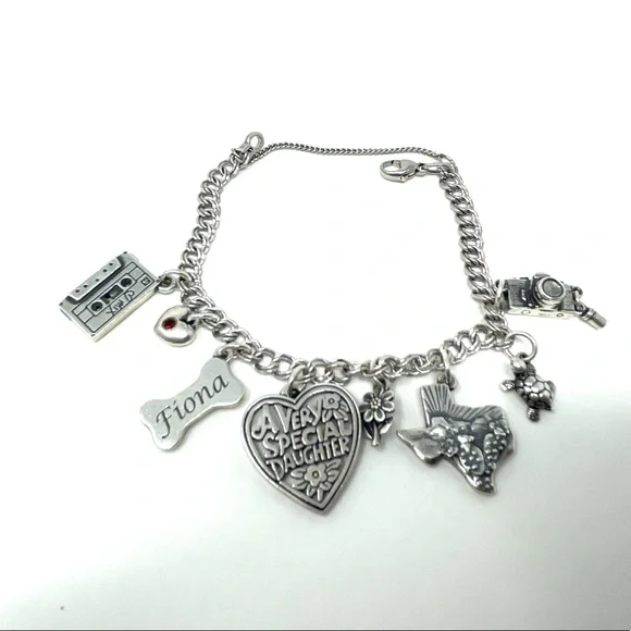JAMES AVERY sterling silver charm bracelet, 8 charms Bracelets